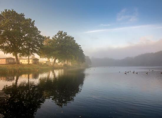 Misty Autumn sunrise over Pearl Lake