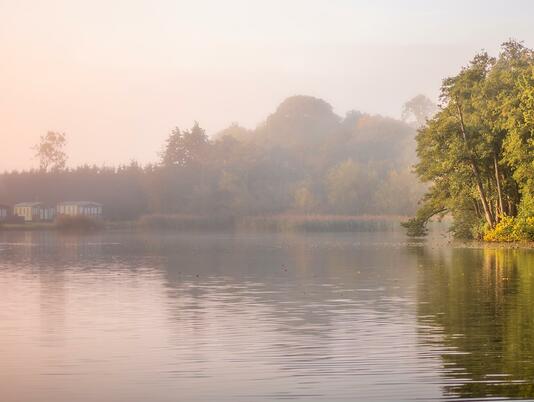 Misty Autumn sunrise over Pearl Lake