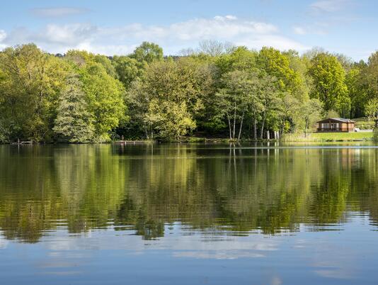 Lodge reflections across Pearl Lake