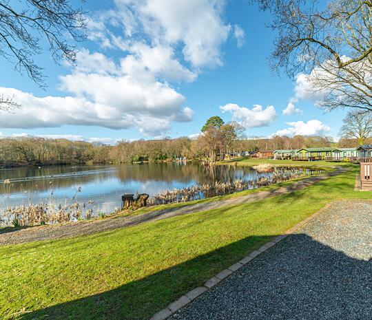 Regal Cranleigh Lodge holiday home for sale at Pearl Lake Country Holiday Park. Lake edge plot photo