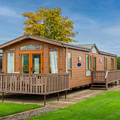 Pre-owned Pemberton Serena static caravan for sale 5 star caravan holiday park. Exterior photo