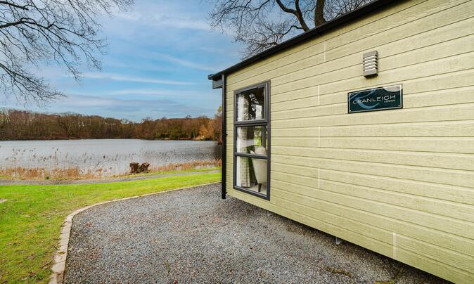 Regal Cranleigh Lodge holiday home for sale at Pearl Lake Country Holiday Park. Lake edge plot photo