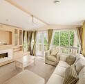 Regal Autograph holiday home for sale on 5 star caravan park with bar restaurant. Lounge photo