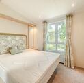 Regal Autograph holiday home for sale on 5 star caravan park with bar restaurant. main bedroom photo