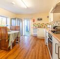 Pet friendly holiday cottage with fishing and golf course - kitchen dining area photo