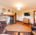 Pet friendly holiday cottage with fishing and golf course - lounge photo